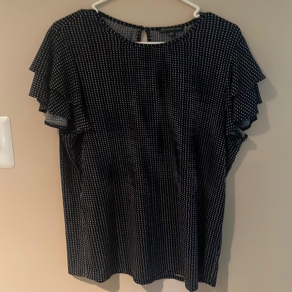 Navy blue blouse with ruffle sleeves